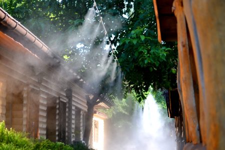 Irrigation system close-up. Humidification of air by steam on the street outdoor in a hot summer day morning